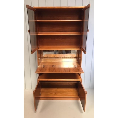12 - A typical Remploy display cabinet. Glazed display area with 2 shelves, over a drop-down, mirror-back... 