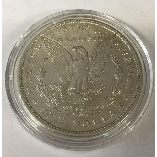 160 - 1879 Morgan Silver Dollar. Certificate of authenticity and presentation folder. 900 Solid Silver.