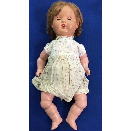 74 - A vintage composite Doll c.1930's.
Opening/closing eyes.
One leg needs re-attaching and shows eviden... 