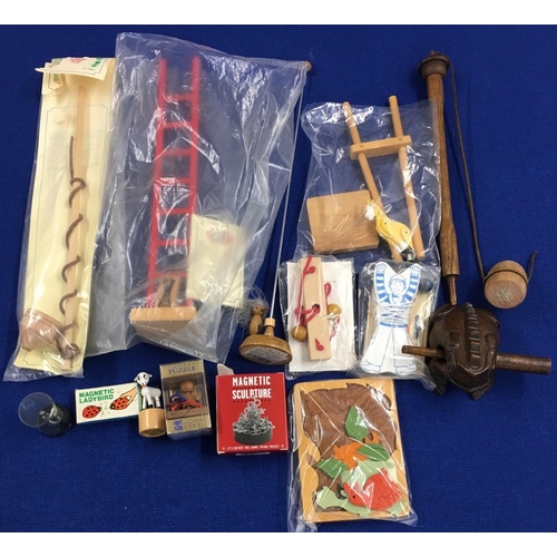 252 - A selection of 14 vintage wooden toys. Includes John Millman toys, Summersaulting Sailor, Whip-Tops ... 