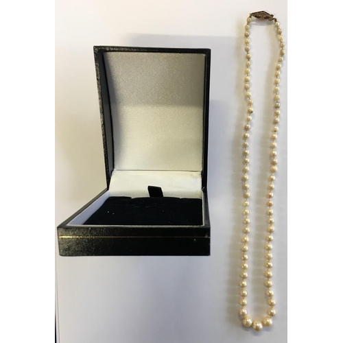 329 - A 40cm Pearl necklace, with 9ct Gold Clasp, in presentation box.