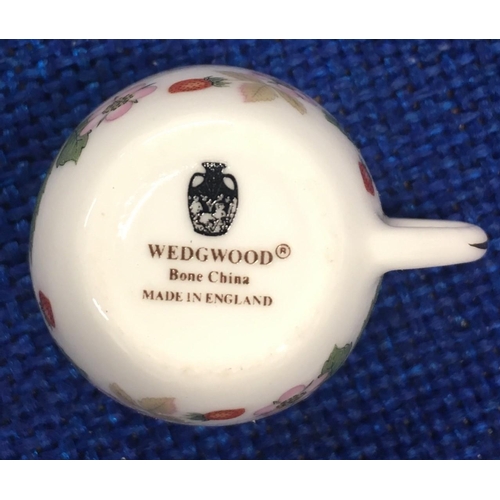 416 - A beautiful miniature teacup, saucer & plate set by Wedgwood 