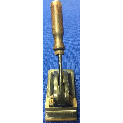 492 - A decorative Victorian hand seal/stamp press.