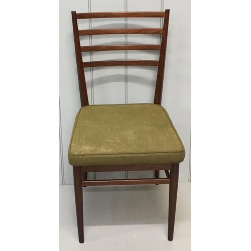 519 - Two matching teak ladder-back dining chairs, upholstered in original green fabric.
Dimensions(cm) H8... 