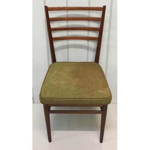 519 - Two matching teak ladder-back dining chairs, upholstered in original green fabric.
Dimensions(cm) H8... 