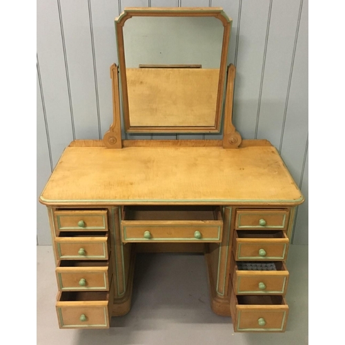 614 - A lovely dressing table by Lamb of Manchester.
A swivel mirror over a single central drawer, flanked... 