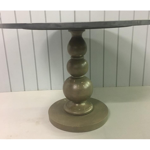 625 - A circular grey pedestal table upon a distressed pedestal base.
Dimensions(cm) H75 W109 D109