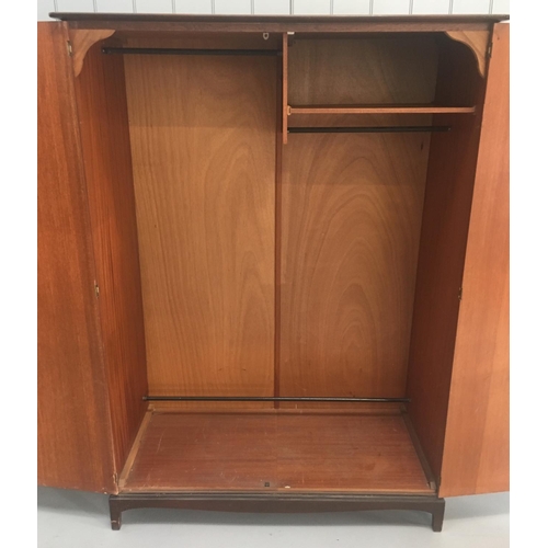 637 - A vintage Stag Minstrel S.150 double wardrobe. Two hanging rails (full and trouser length) and a sho... 