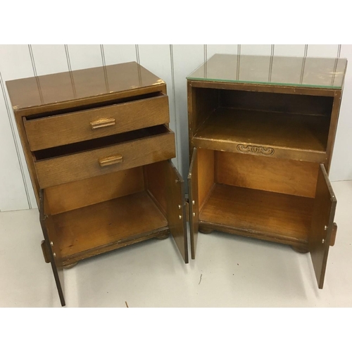 699 - A pair of oak side/bedside cupboards made by 