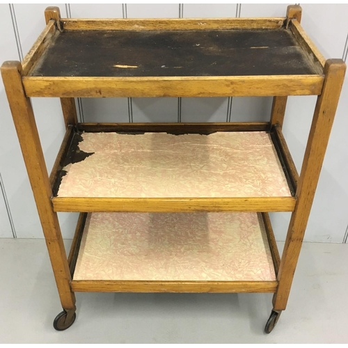 702 - A vintage oak tea-trolley.
Shelves lined with vintage paper.
Dimensions(cm) H78 W65 D42