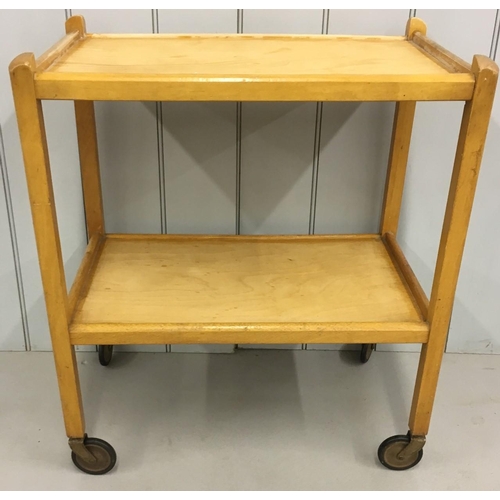 684 - A vintage Beech tea trolley.
Dimensions(cm) H69 W61 D38