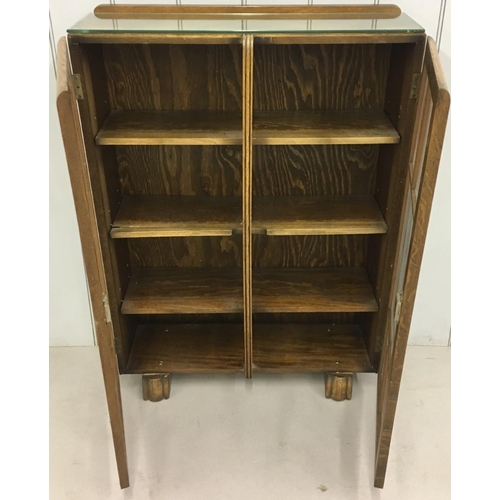 596 - A charming Arts & Crafts oak/glazed bookcase.
Three internal shelves. Individually locking doors. Ke... 