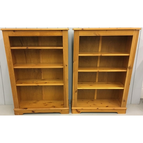 245 - A pair of matching medium sized, pine, open bookcases. Each having three adjustable shelves.
A furth... 