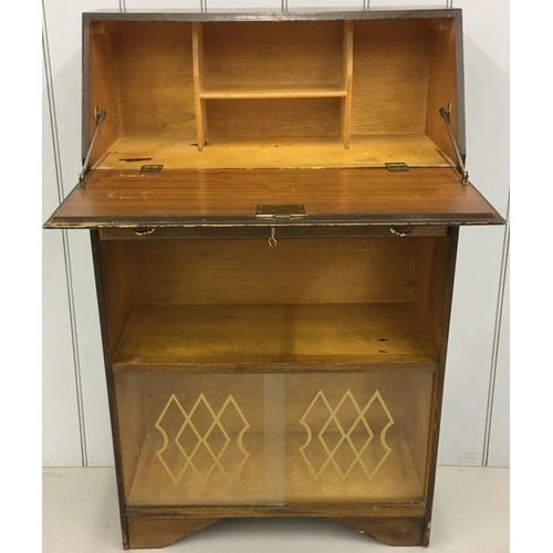 504 - An early 1900's Bureau. Drop-down door over single drawer, over single shelf, over patterned glass-d... 