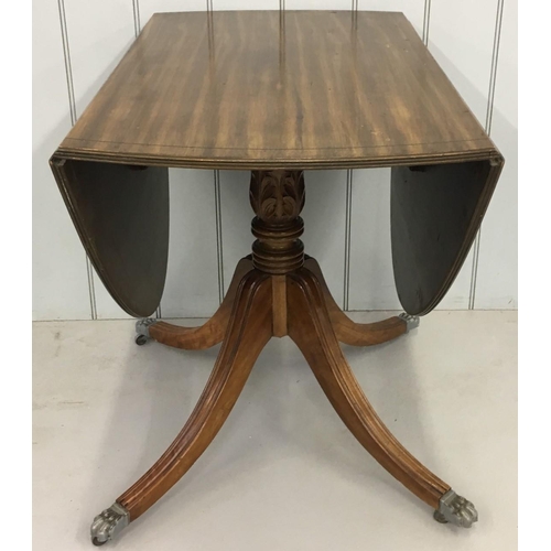 635 - An oval drop-leaf table.
carved support and claw feet.
Dimensions(cm) Open H73 W134 D90. Closed H73 ... 