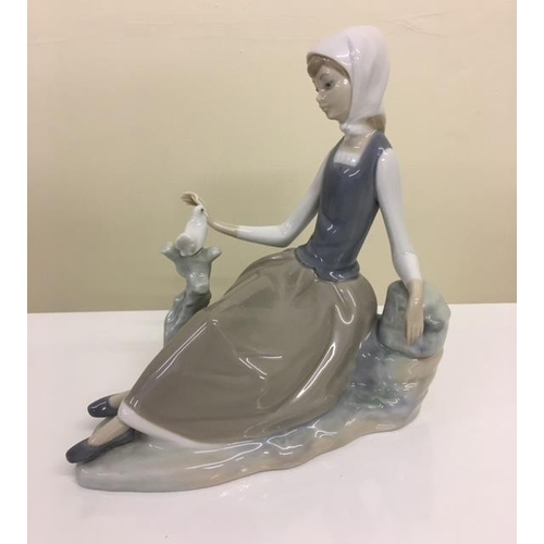 233 - A Lladro figurine - Shepherdess with Dove.  1969-1993. No.4600.
Height 16cm