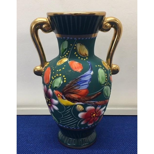 213 - A pretty, twin-handled French vase.
Dimensions(cm) H20 W14 D11