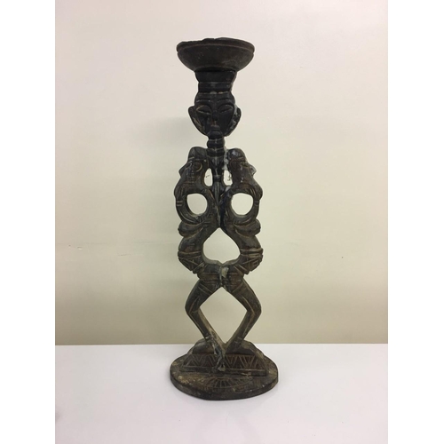 603 - A vintage, carved, wooden candle holder.
(Height 50cm, Width 18cm).