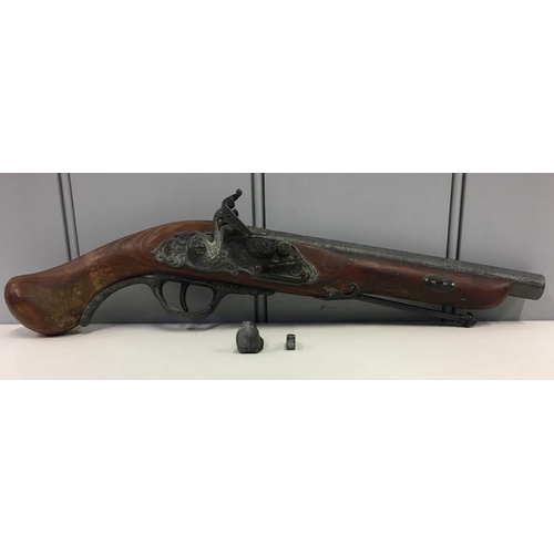 584 - An ornamental, Flintlock Pistol. Some damage as per picture.