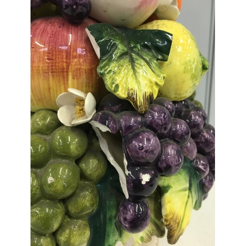 469 - A tall, porcelain Fruit, table centrepiece. Minor damage to single leaf in centre.
Height 34cm.