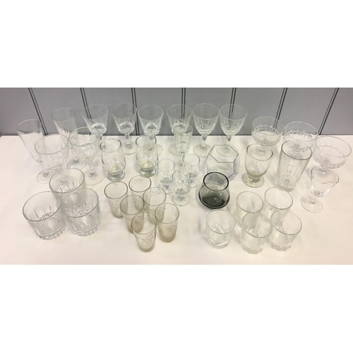 595 - A mixed lot of approximately 38 glassware items. Includes two sets of four wine glasses, set of four... 