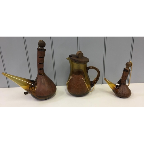 599 - Two vintage Spanish Porrons (large & small), together with a Spanish Sangria jug. All amber glass an... 