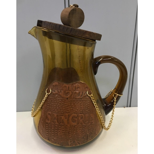 599 - Two vintage Spanish Porrons (large & small), together with a Spanish Sangria jug. All amber glass an... 