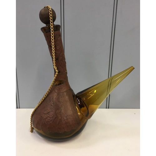 599 - Two vintage Spanish Porrons (large & small), together with a Spanish Sangria jug. All amber glass an... 