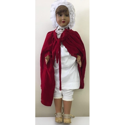 338 - A beautiful, large scale, composite doll. c.1920's. Eyes open/close. Appears in original clothing. S... 