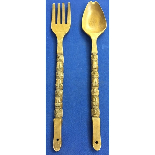 555 - A pair of decorative, carved, oversized fork & spoon,
Length 92cm