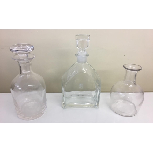 585 - A heavy glass carafe (probably Georgian), together with a Luigi Bormioli Italian decanter and anothe... 