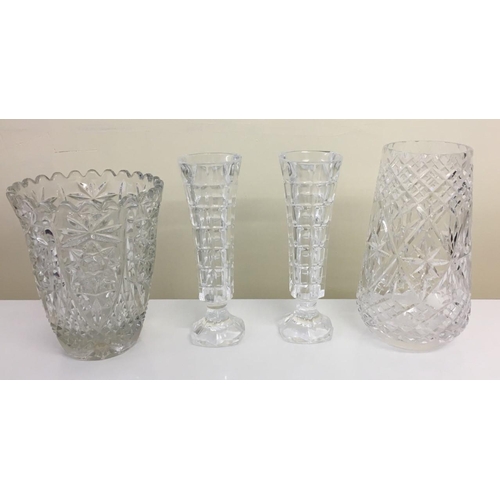 586 - A selection of four crystal vases. Includes one Edinburgh Crystal and a pair of bud vases.