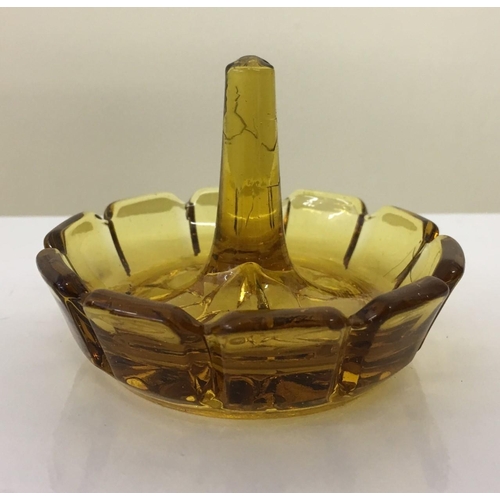 601 - An early Amber glass Dressing Table set. Includes tray, ring holder & three lidded trinket pots (2 s... 