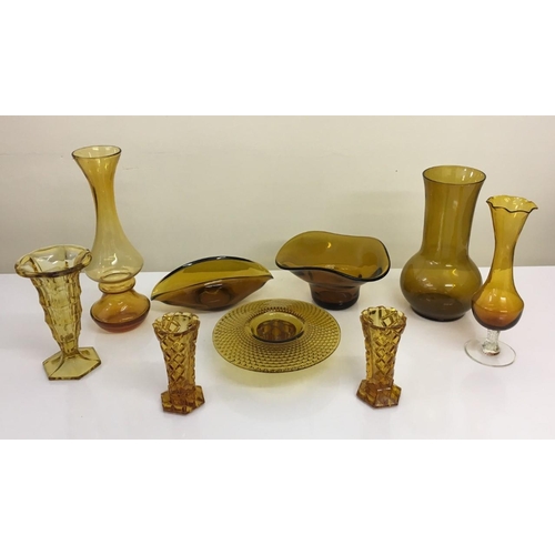 597 - A mixed lot of Amber glass vases & flower arrangers.
Nine in total