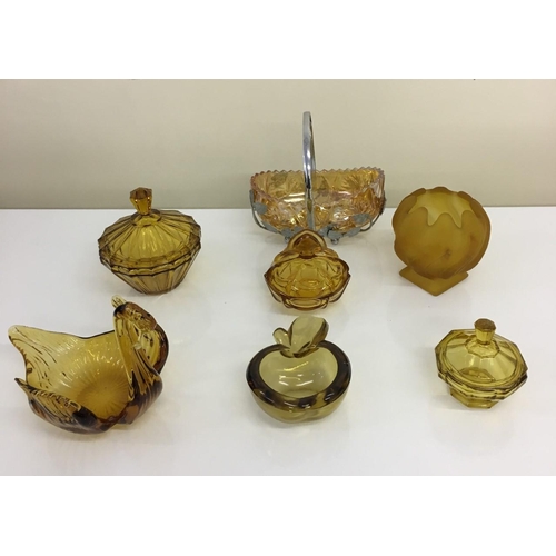 598 - A selection of seven Amber glass items. Sweet dishes, candleholder, ashtray etc.