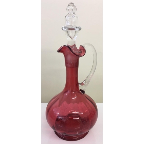 593 - A vintage Cranberry glass decanter.
31cm tall.
