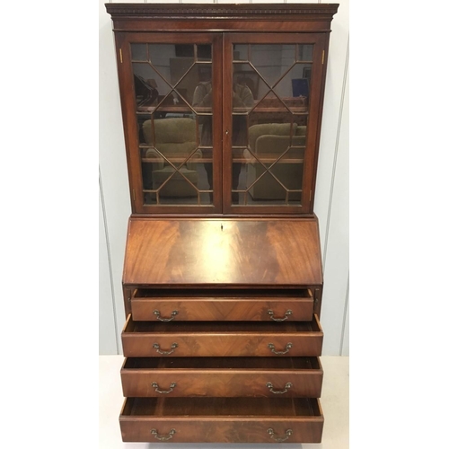 53 - A Mahogany, Edwardian Bureau Bookcase. Glazed bookcase with two internal shelves, over a 4-drawered ... 