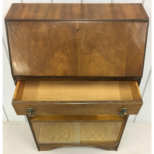 98 - An early 1900's Bureau. Drop-down door over single drawer, over single shelf, over patterned glass-d... 