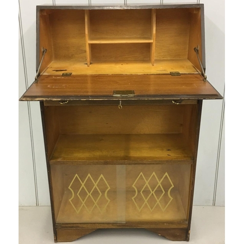 98 - An early 1900's Bureau. Drop-down door over single drawer, over single shelf, over patterned glass-d... 