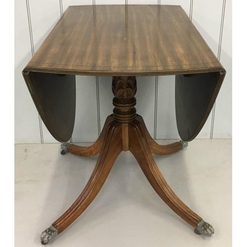 8 - An oval Drop-Leaf table.
carved support and claw feet.
Dimensions(cm) Open H73 W134 D90. Closed H73 ... 
