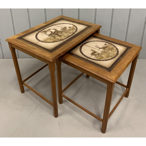 9A - A mid-century,  nest of 2 tiled tables, with dear scenes.
Largest dimensions(cm) H47 W55 D40.