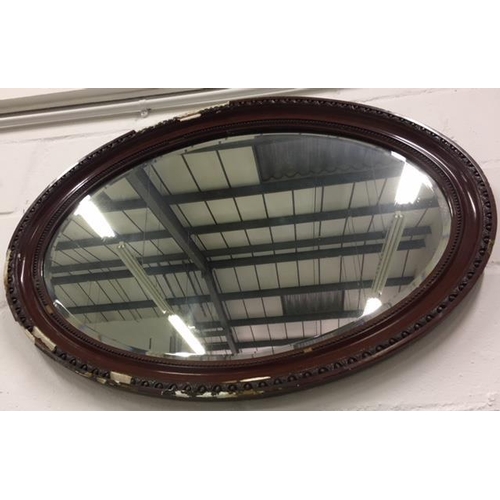 70 - A bevel-edged oval plaster Mirror.
Dimensions (cm) H62 W88