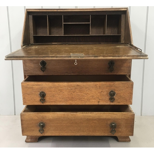 97 - A vintage, oak Bureau. Drop-down desk front over three drawers.
Dimensions(cm) H97 W78 D41