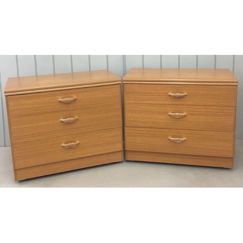114 - A matching pair of bedroom Chests of Drawers. Three drawers, on castors and teak in colour. Made by ... 