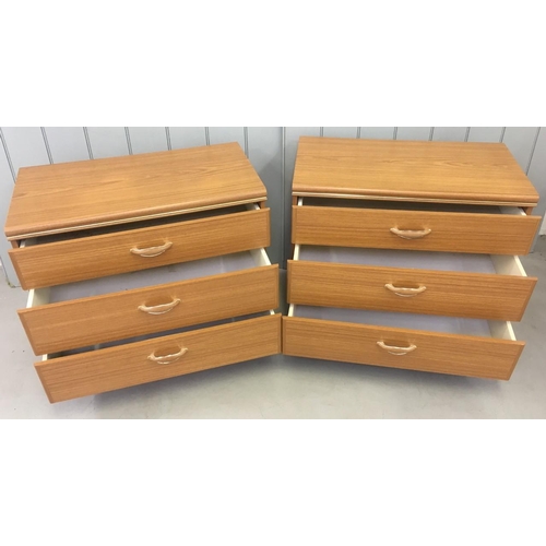 114 - A matching pair of bedroom Chests of Drawers. Three drawers, on castors and teak in colour. Made by ... 