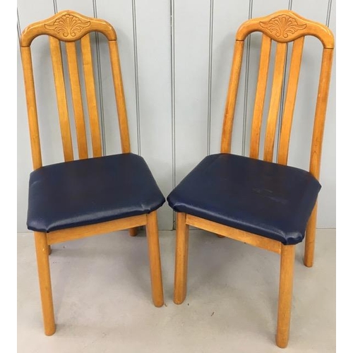 156A - Two beech coloured dining chairs, with blue vinyl seat pads.
Dimensions(cm) H102 (47 to seat) W44 D5... 