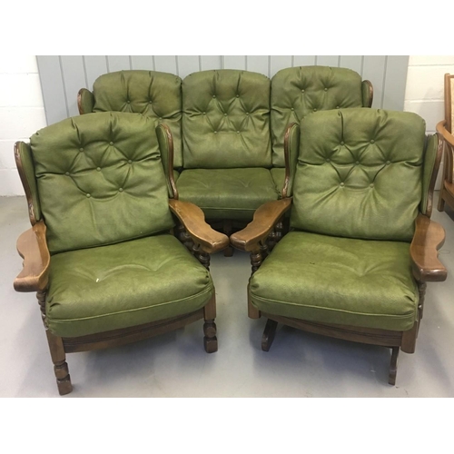 160 - A vintage Oak-framed, green, faux leather suite. Three seater sofa, with armchair and rocking armcha... 