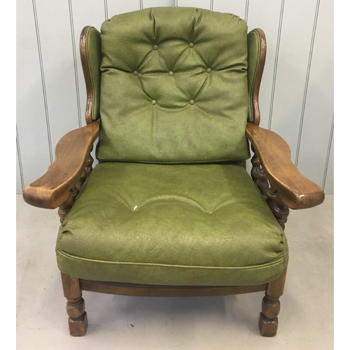 160 - A vintage Oak-framed, green, faux leather suite. Three seater sofa, with armchair and rocking armcha... 