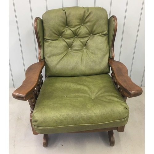 160 - A vintage Oak-framed, green, faux leather suite. Three seater sofa, with armchair and rocking armcha... 