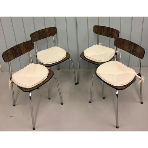 163A - A stylish set of four mid-century Dining Chairs. Chrome legs with laminated backrest and seat.
Dimen... 